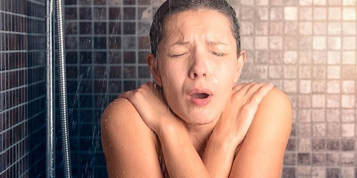Woman Having Cold Shower